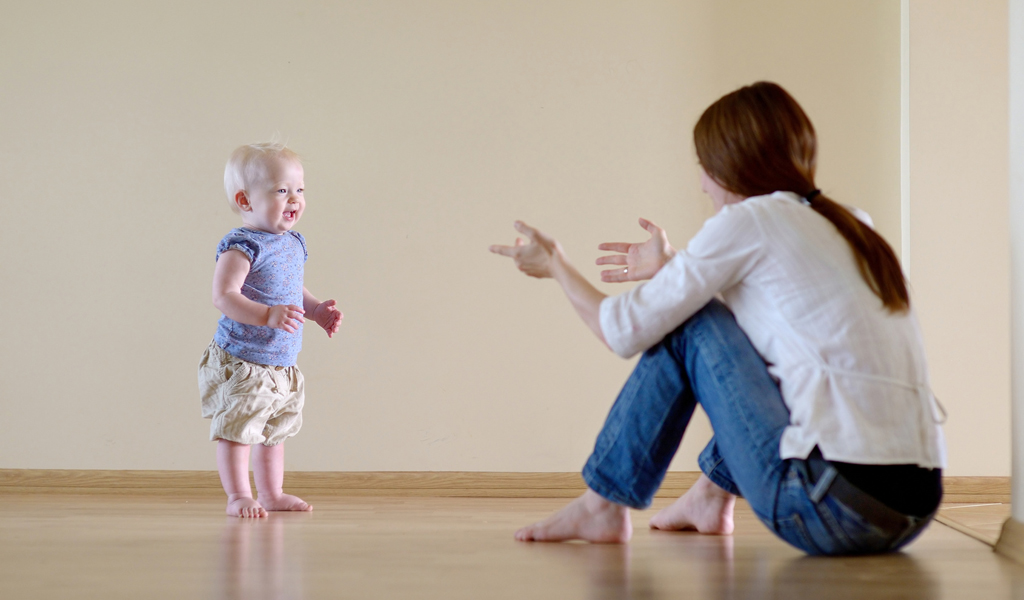 Baby taking store first steps